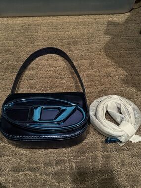 Blue Patent Leather Shoulder Bag with Decorative Accent